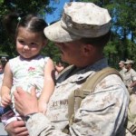 In the photo provided by the office of Rep. Chris Smith, Sgt. Micheal Elias shares a tender moment with his daughter Jade.